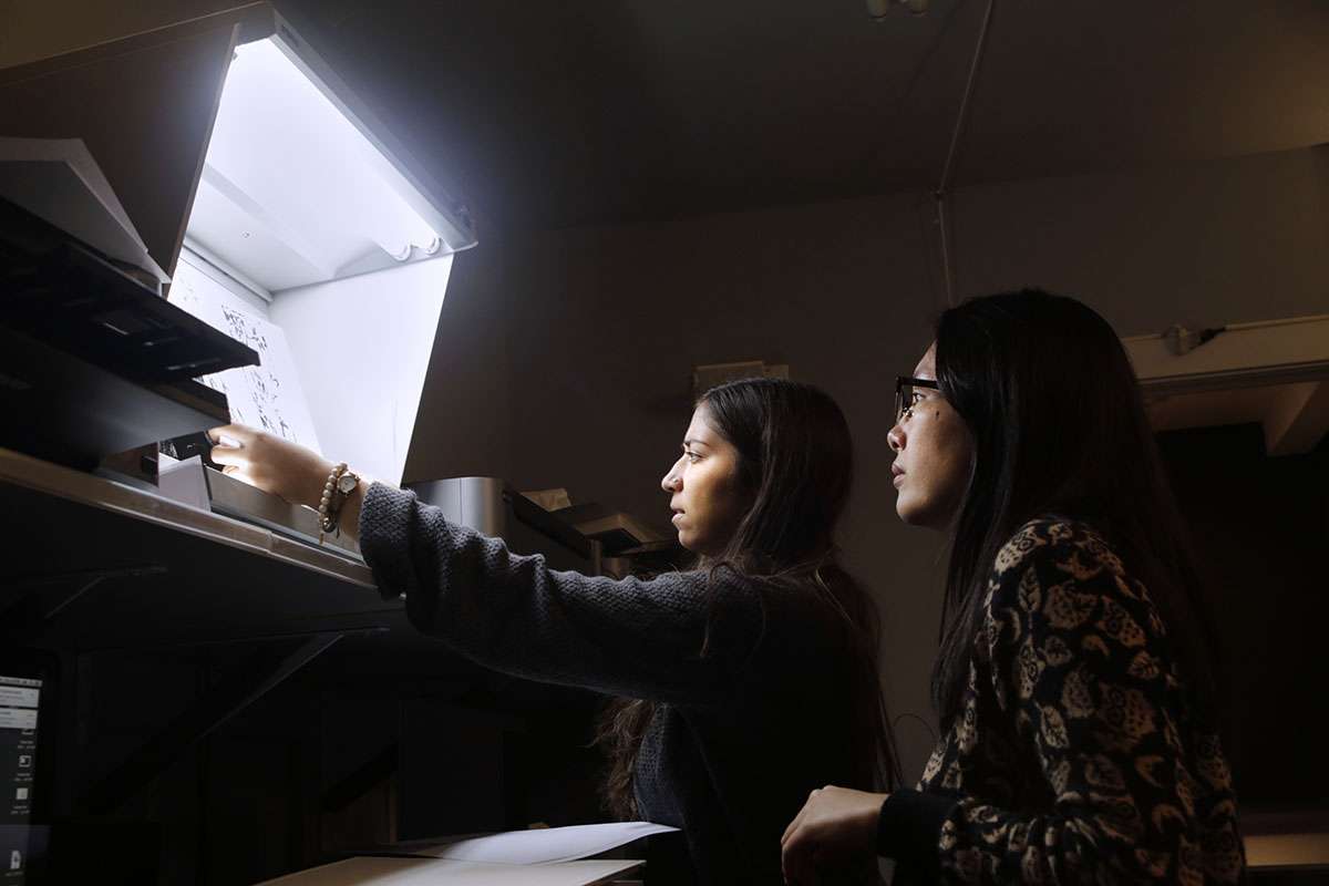 Claire Warden and Ke Peng (R) evaluate digital test prints. Photo by David Cunningham, courtesy CPW. 