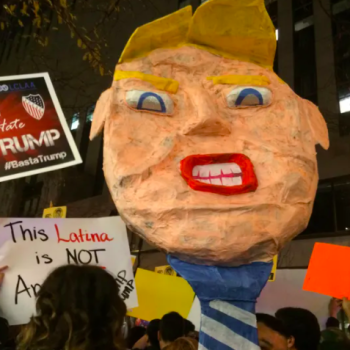 Image of artist's piñata of Trump at the 2015 protests outside of SNL, New York City, Photo by Amanda Terkel via Huffington Post