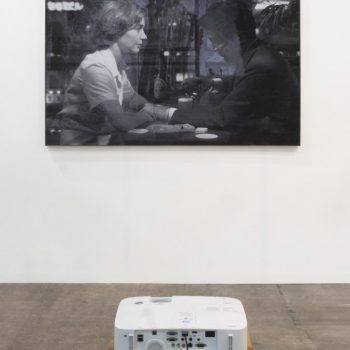 Never forget, 2015. HD video projection over inkjet print, One channel video: H.264, 1280 x 720 - Loop Print: 182.5 x 114 cm.
